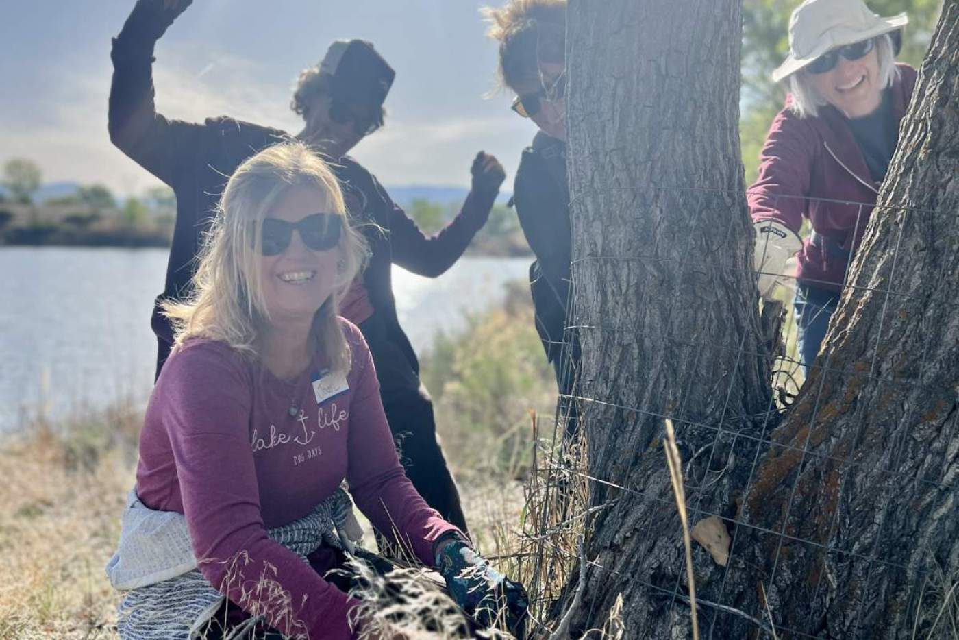 4 volunteers with tree